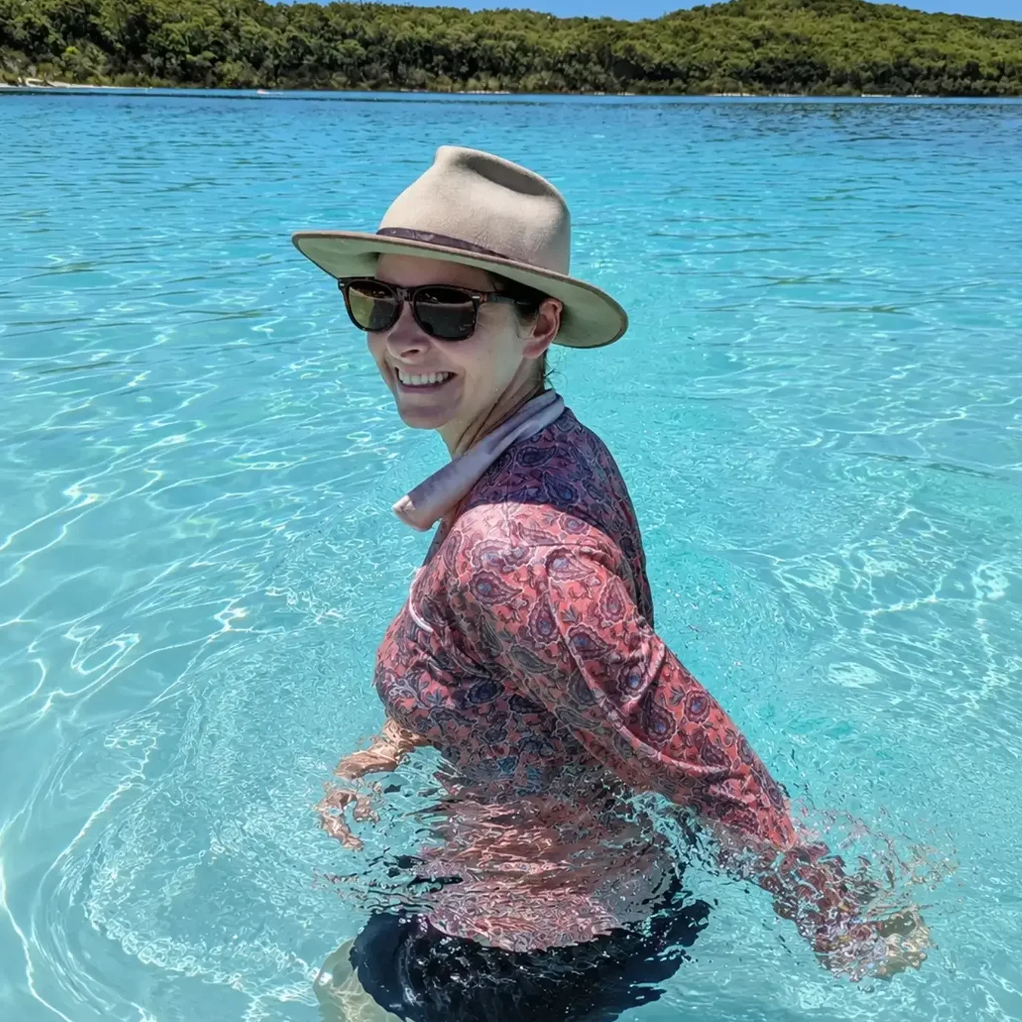 woman applying sunscreen outdoors